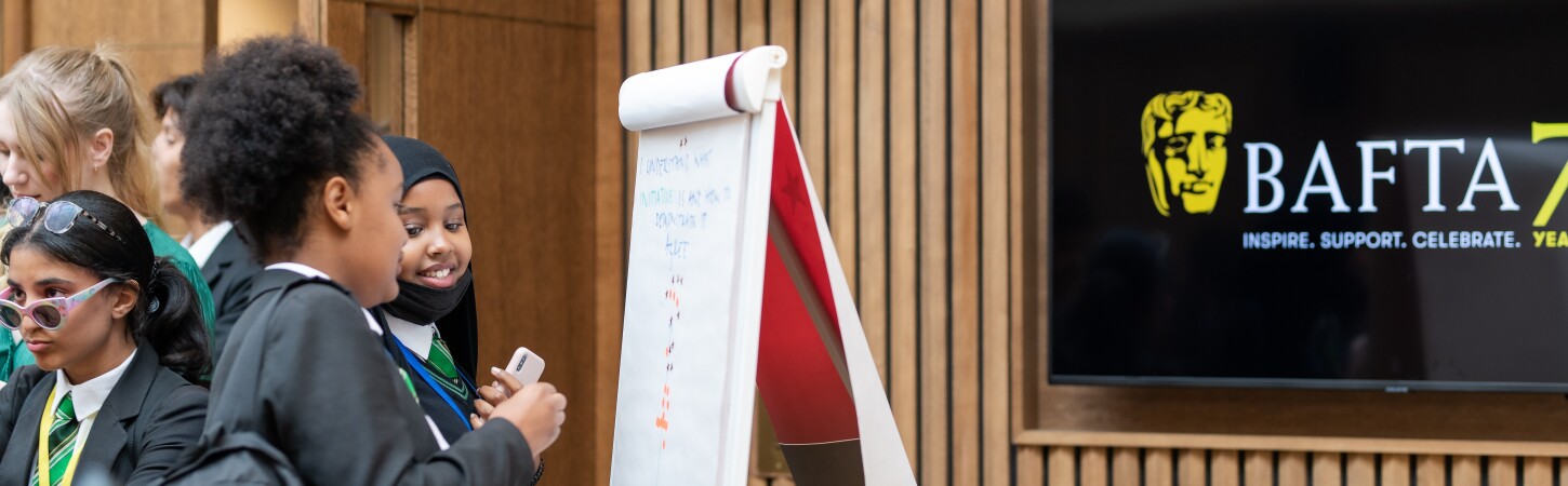 group tour writing on a flipchart 2 1